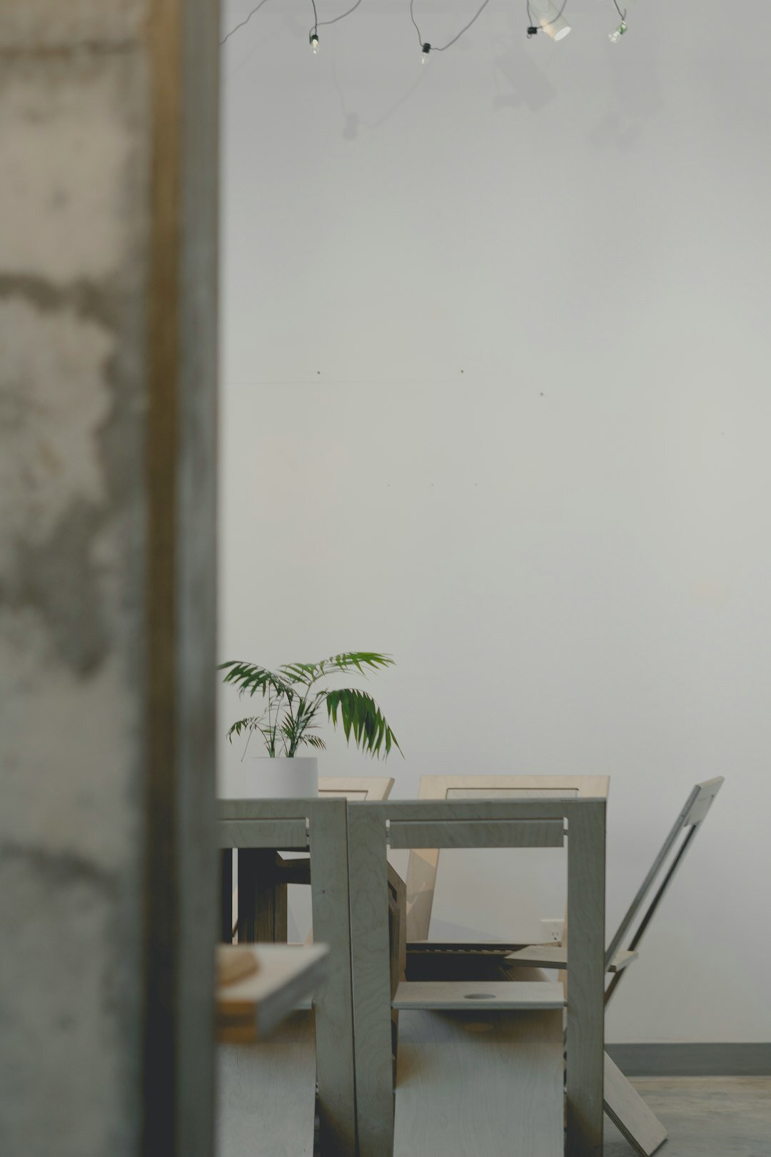 Small diverse team discussing around a table in a bright office
